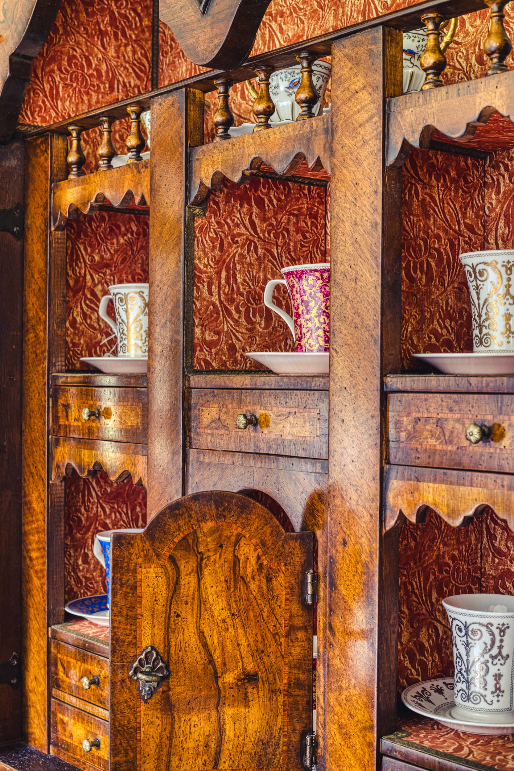 Vibrant red and brown furniture in the Bussandri Villa